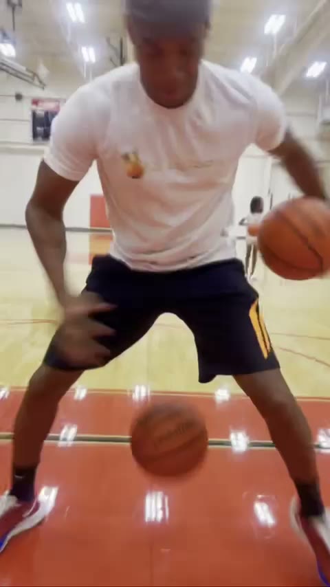 Coach Rickey Huckaby running a two ball dribbling drill